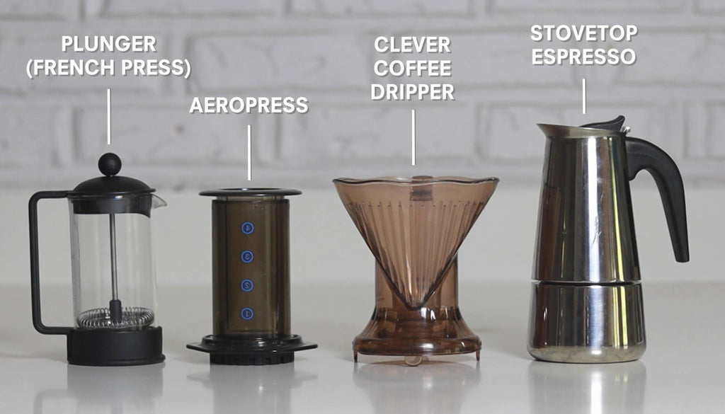 home coffee brewers lined up on bench