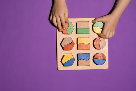 Montessori toy on a purple background