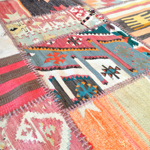vintage flatweave rugs cut into squares and pieced together in a patchwork.