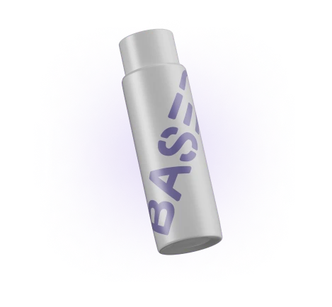 Lip balm stick with 'BASIS' label, surrounded by a purple glittery haze.