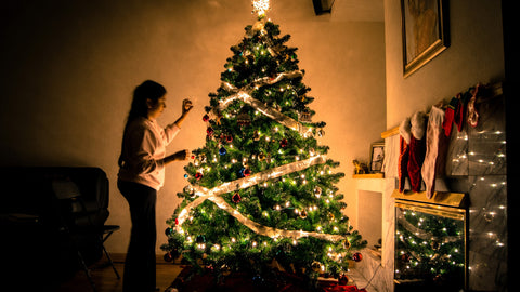 Christmas tree being decorated