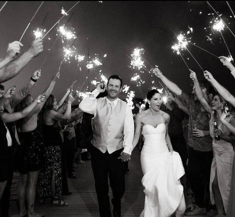 bride and groom exiting wedding reception with wedding sparkler sendoff
