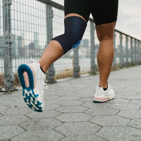 guy running wearing knee caps