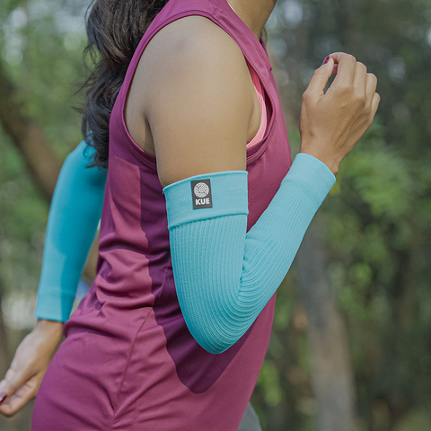 female running in arm sleeves