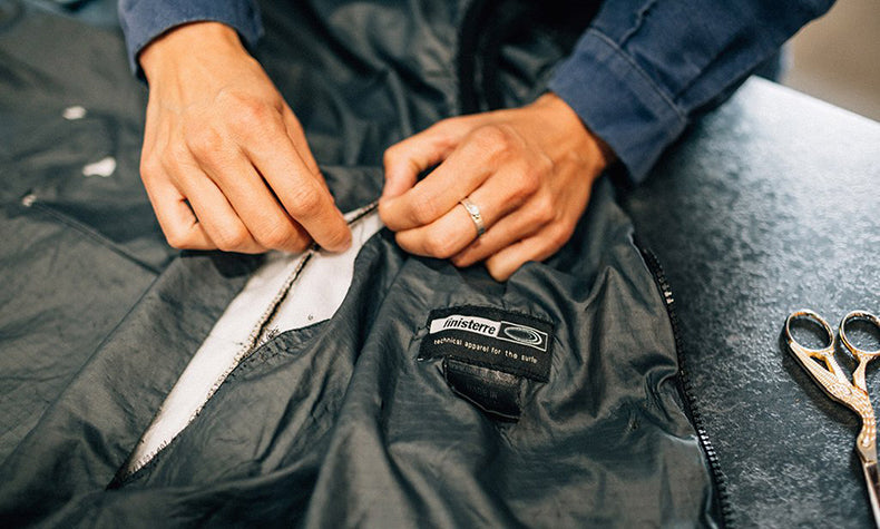 finisterre jacket being repaired