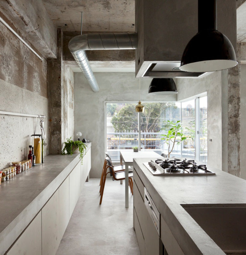Concrete Apartment black enamel pendants in kitchen