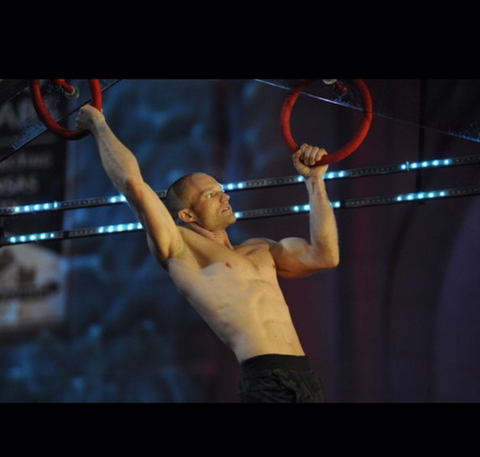 Brian Arnold competes on the rings on American Ninja Warrior