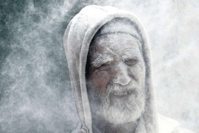 Man in cloud of chalk dust