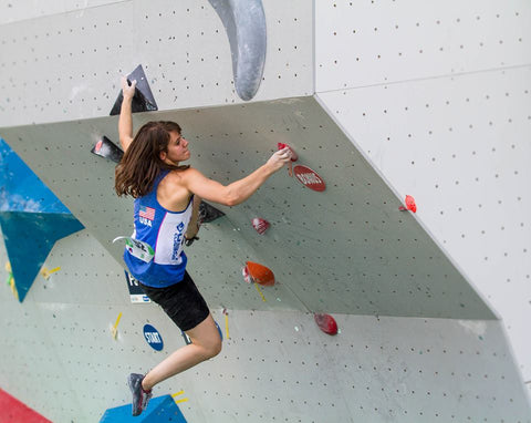 Zoe Steinberg climbing in a bouldering competition