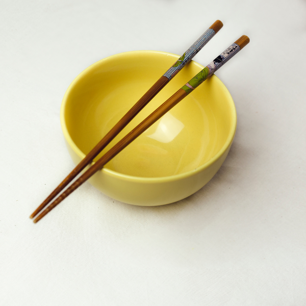 Chopsticks on empty bowl
