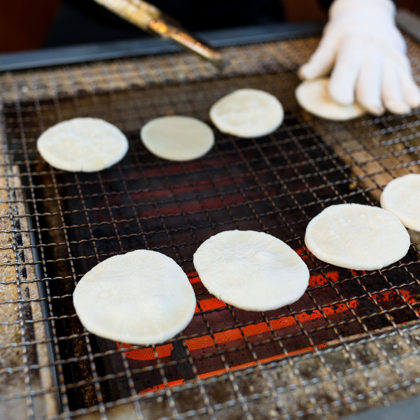 Cooking senbei rice crackers