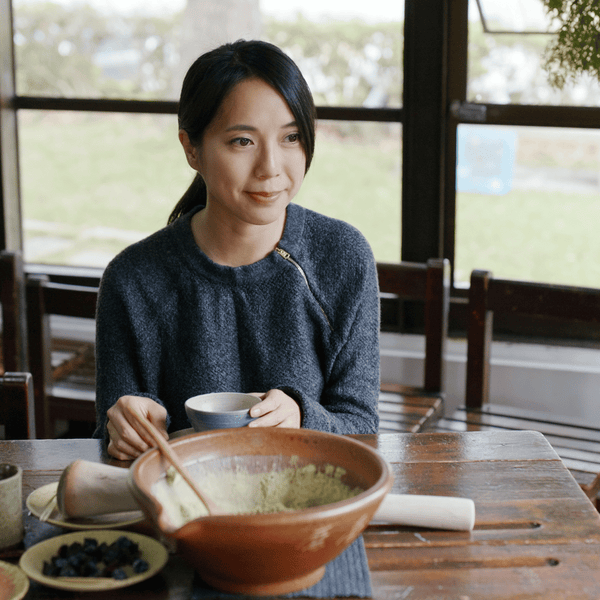 Woman Making Traditional Chinese Ground Tea