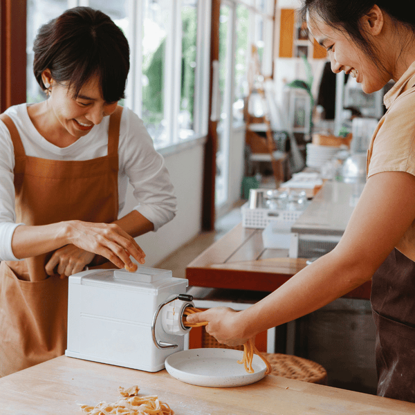 Women making noodles