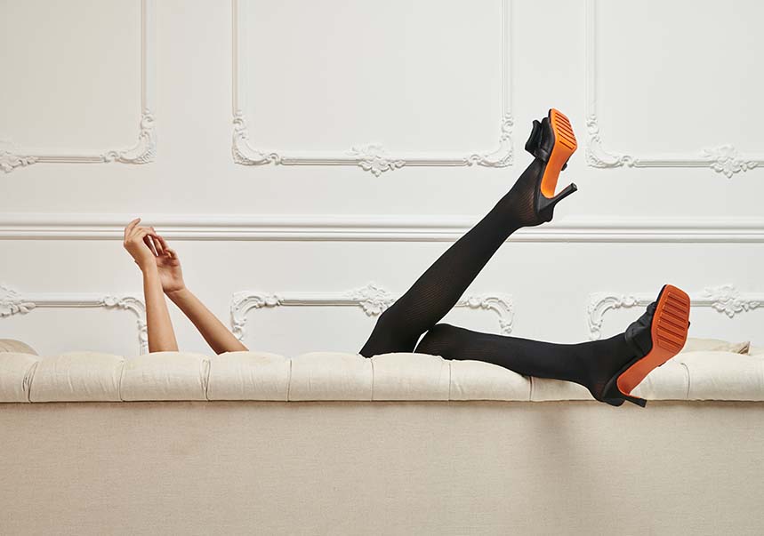 Dore Dore promo image, person lying on couch, legs in the air