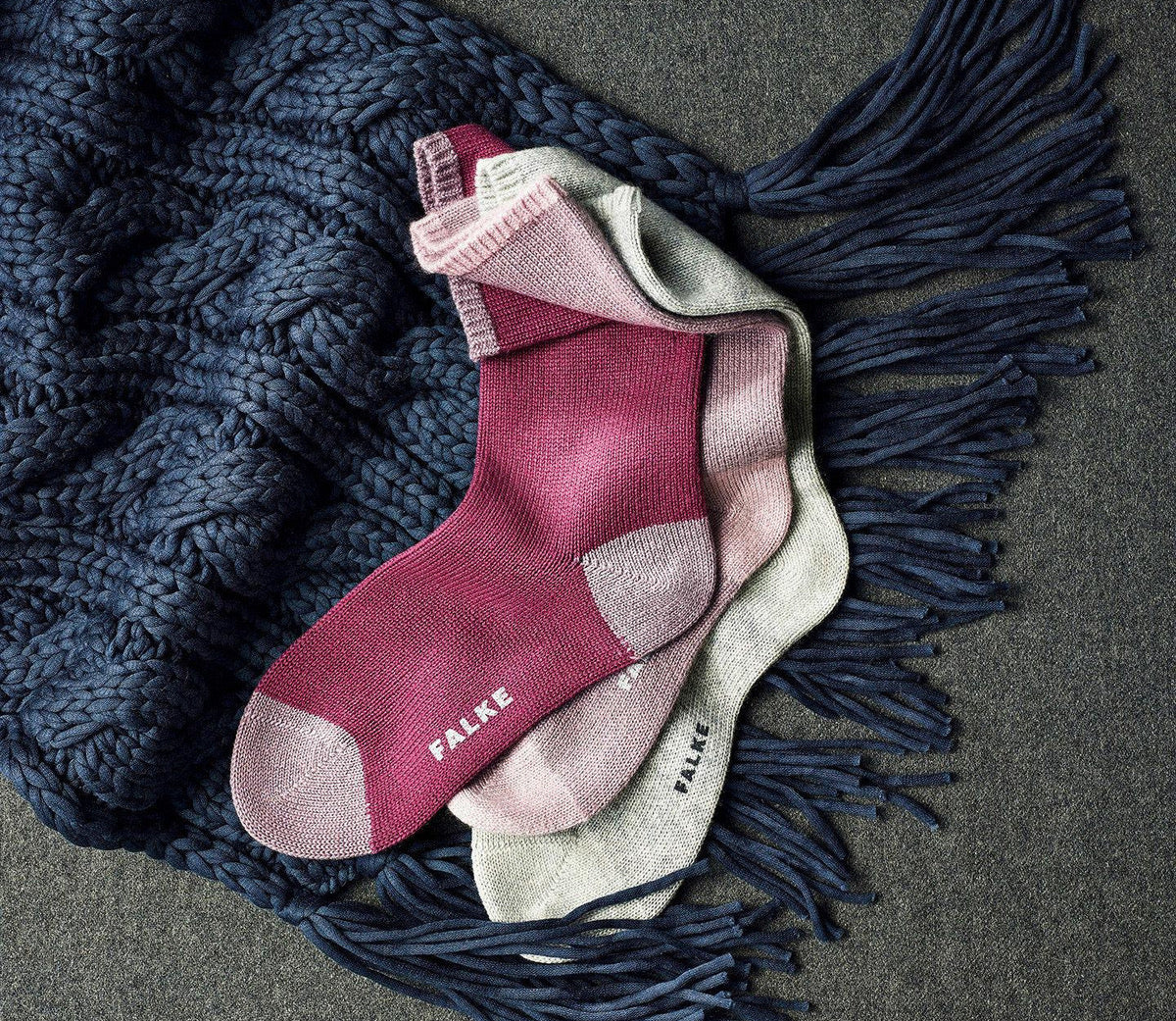 Falke cashmere socks sitting on a scarf