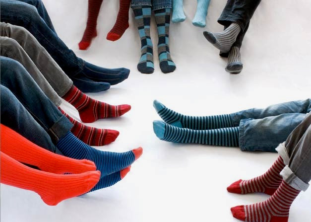 Closeup of lots of feet in Marcoliani socks, showing off their variety of designs