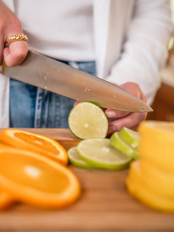 lady cutting citrus