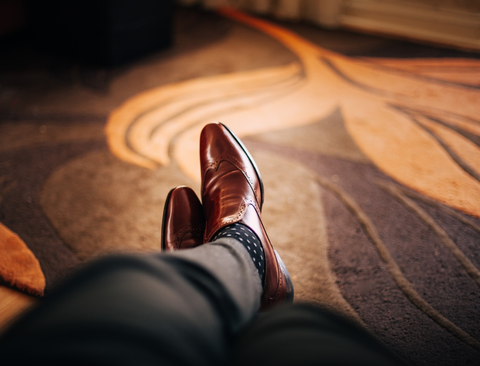 A Man is Wearing Brown Leather Shoes.