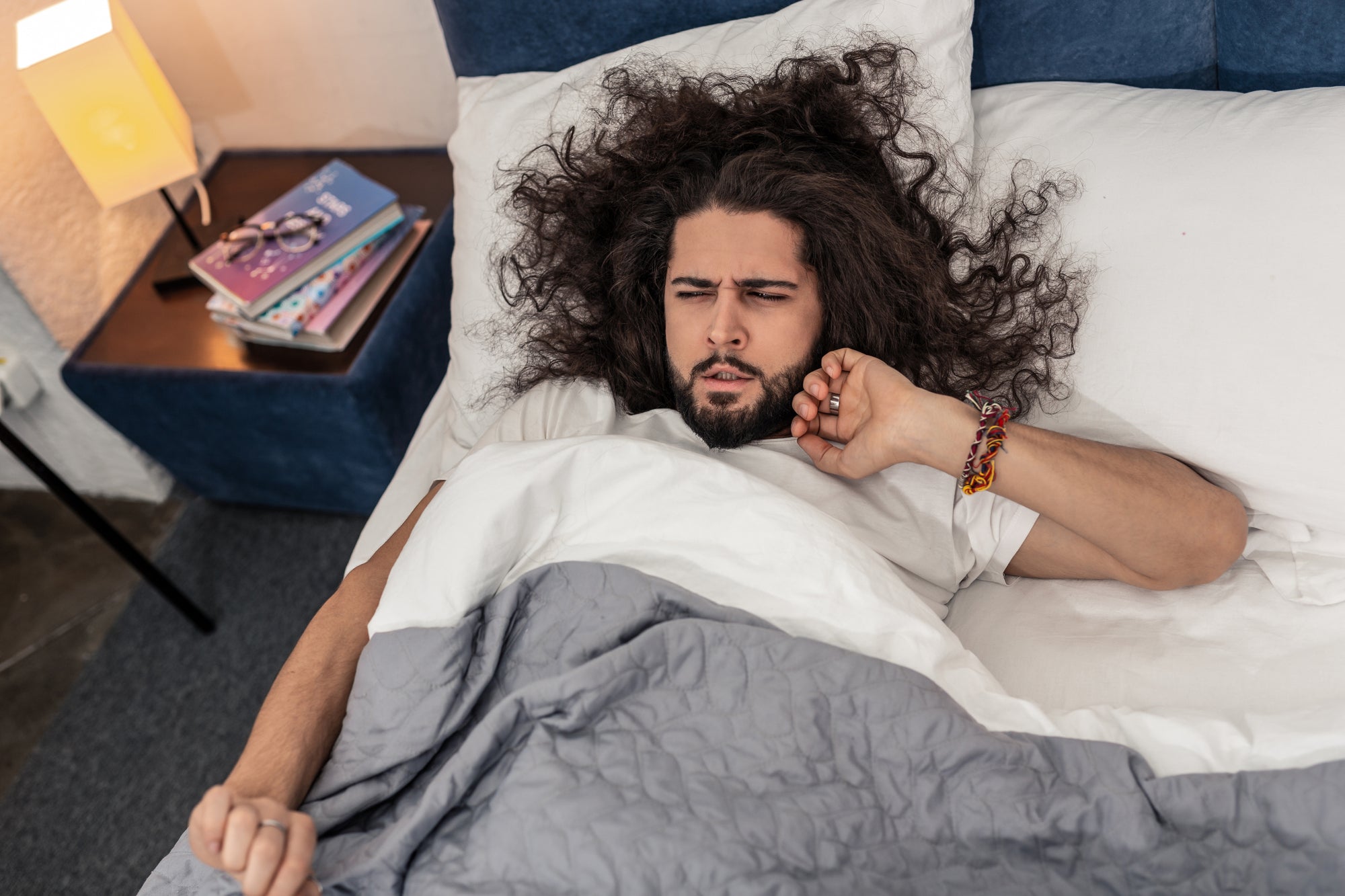 man-with-long-hair-sleeping.jpg