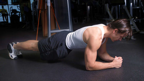 Fitness trainer demonstrating the plank position