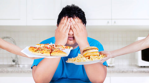 fat man resisting unhealthy foods
