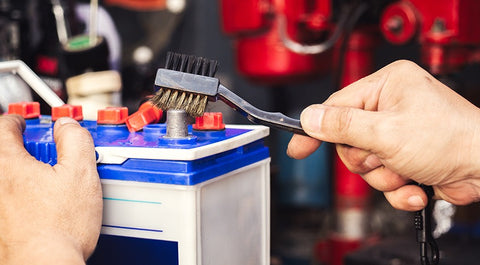 a person maintaining a battery