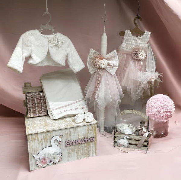 christening package for girls complete with clothing, a favours box, candle