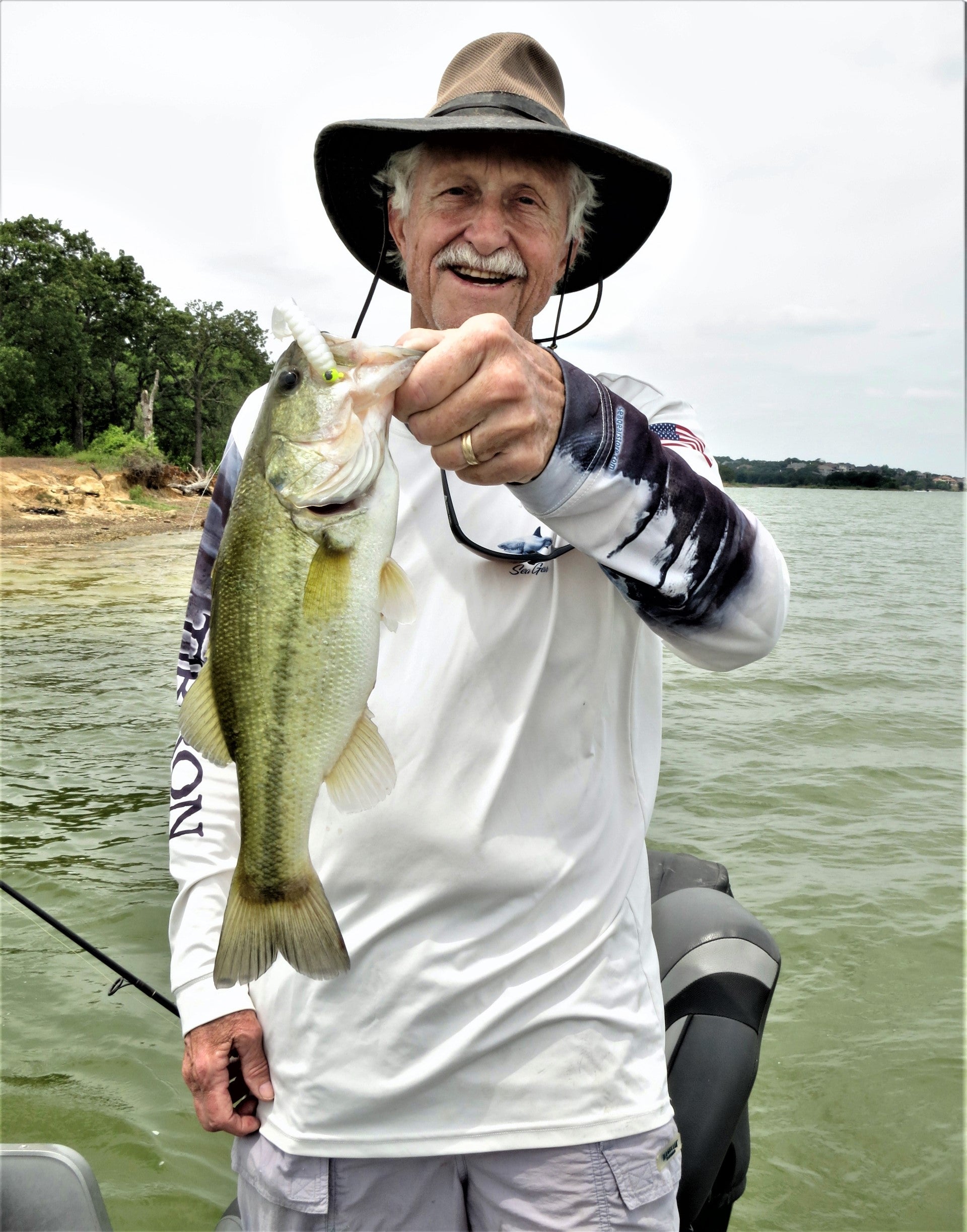 Gentleman with a Large Mouth Bass he caught