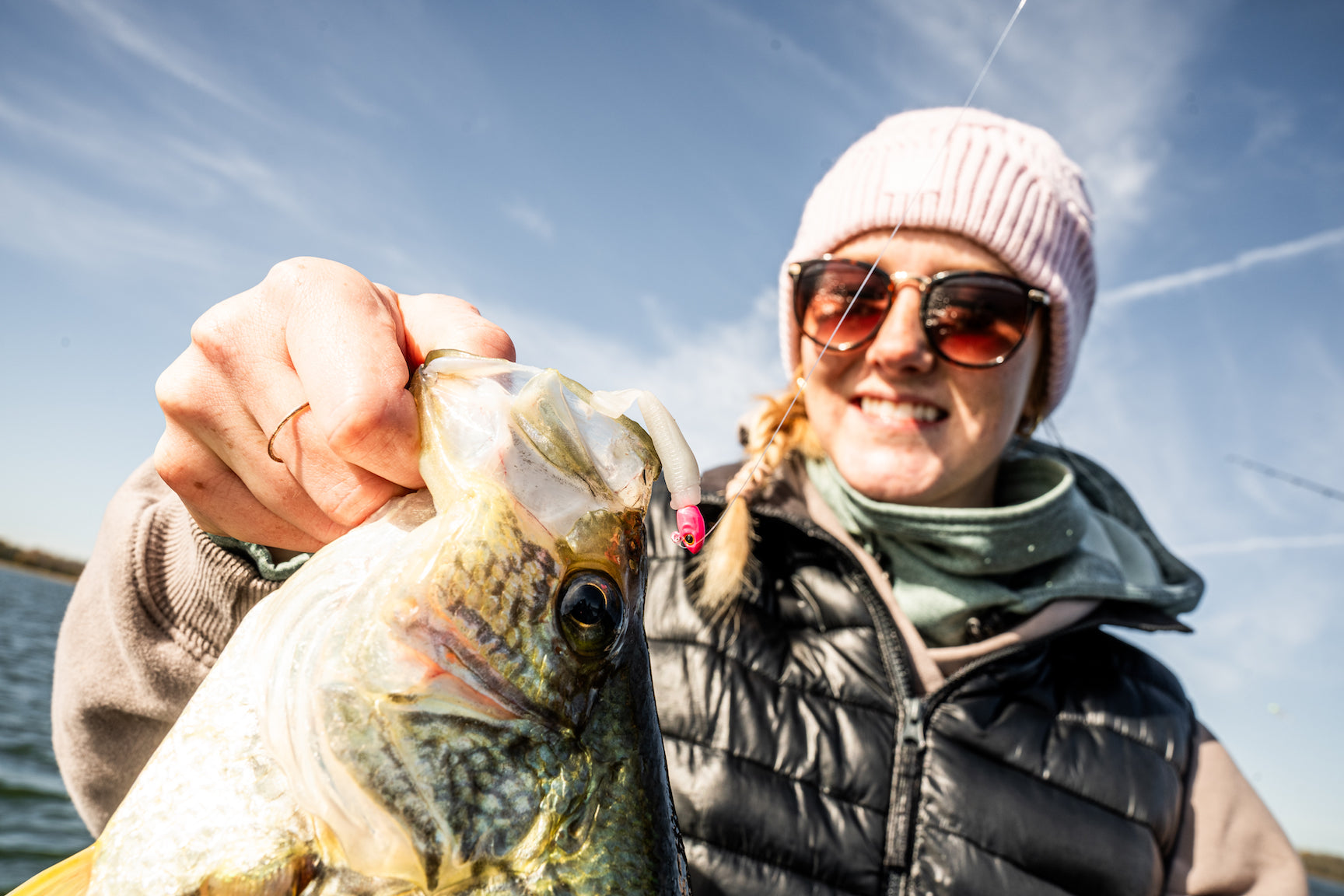 A woman with a crappie caught with Micro Finesse plastics