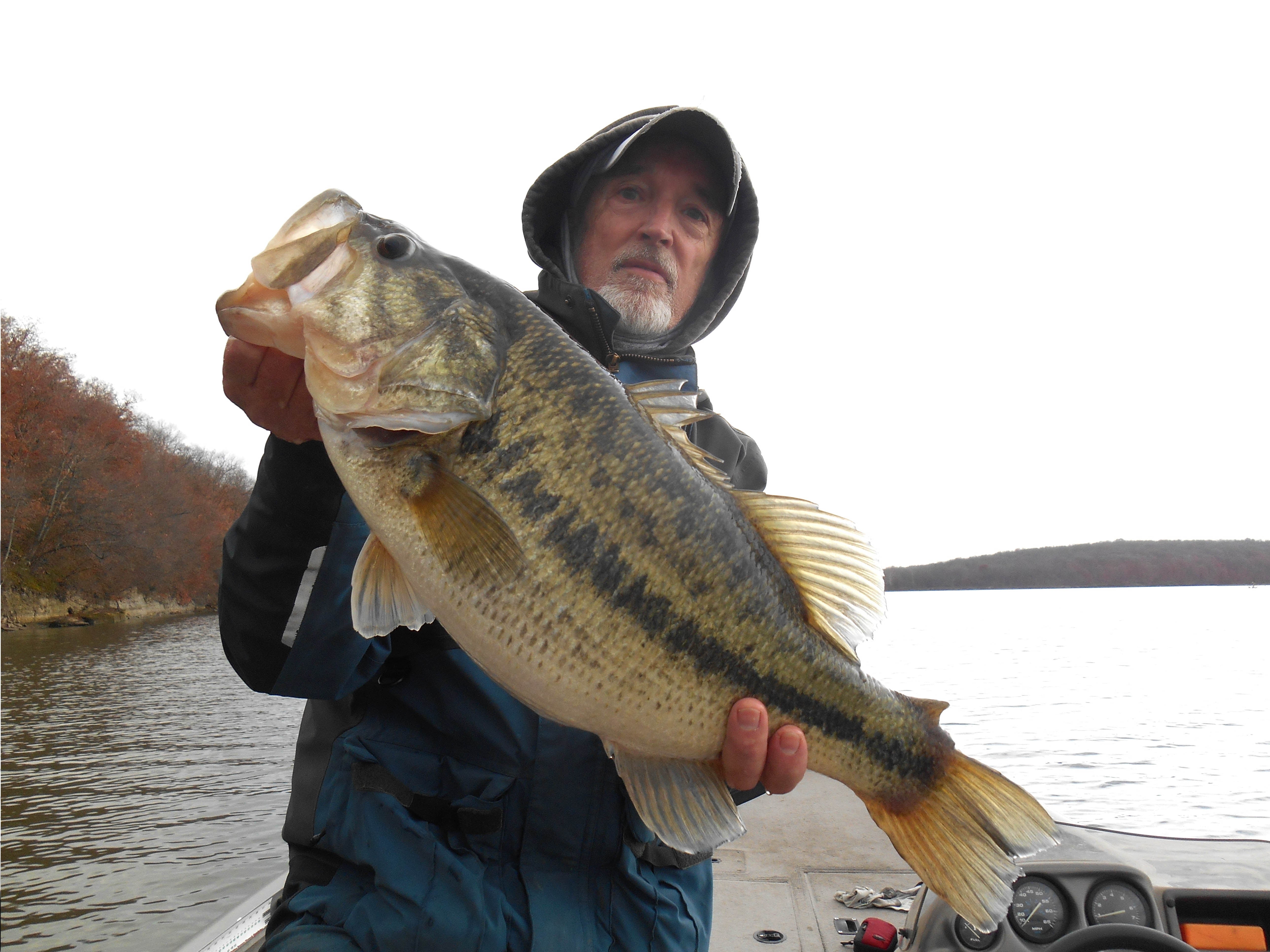 Bob Gum with a large mouth bass he caught