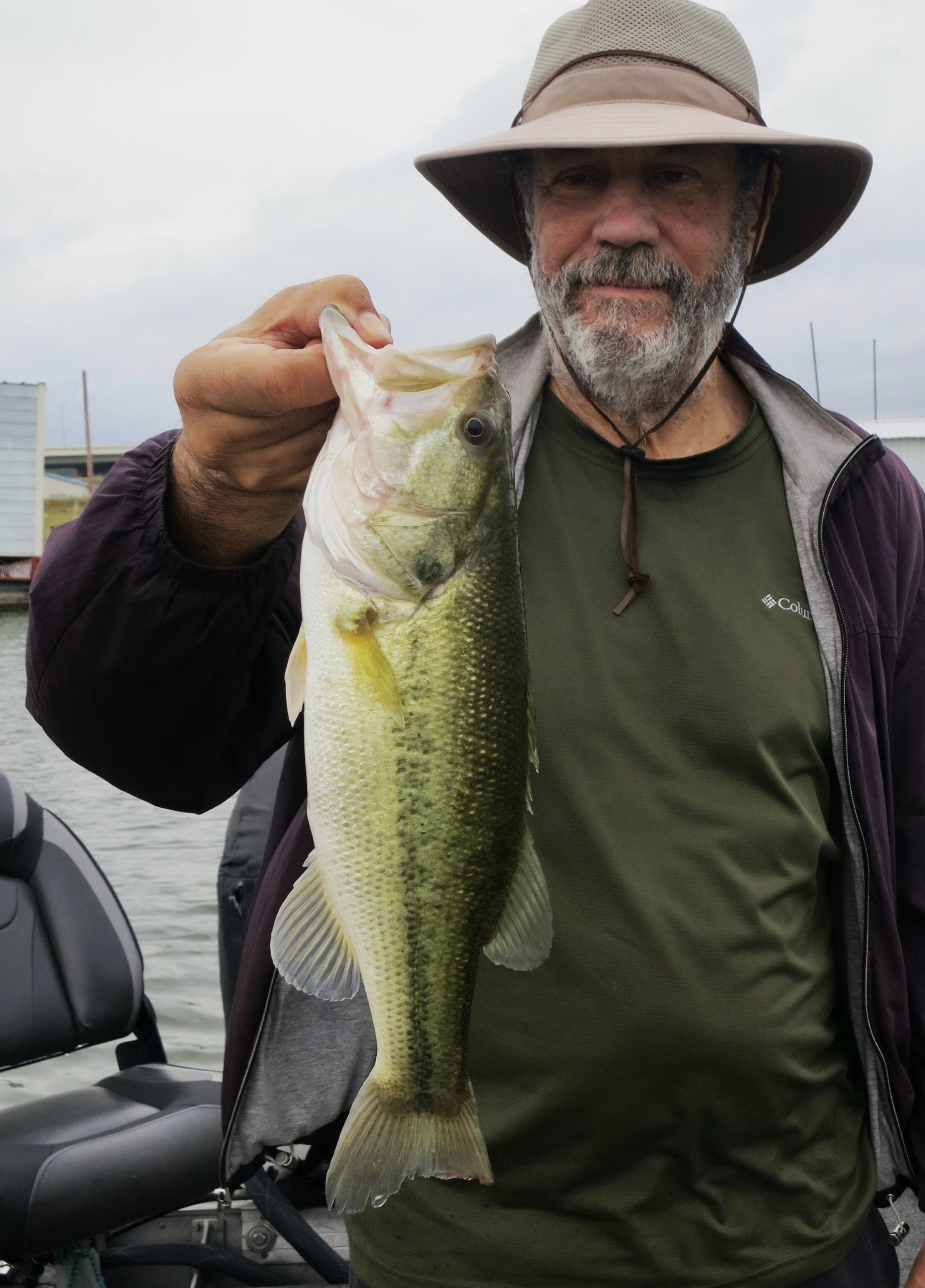 Gentleman holding large mouth bass he caught on the Finesse WormZ