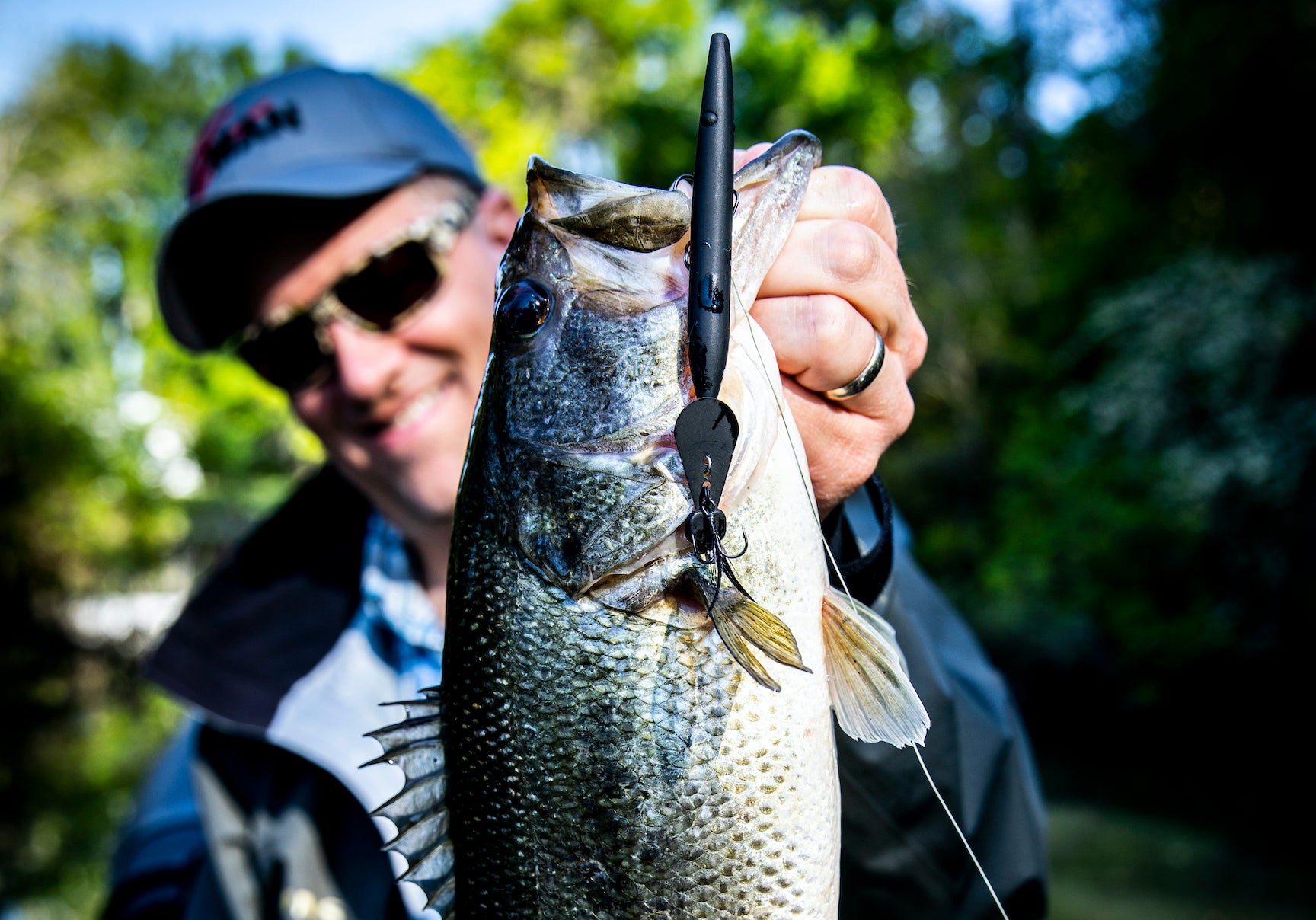 Corey Schmidt with a bass caught on the HellraiZer