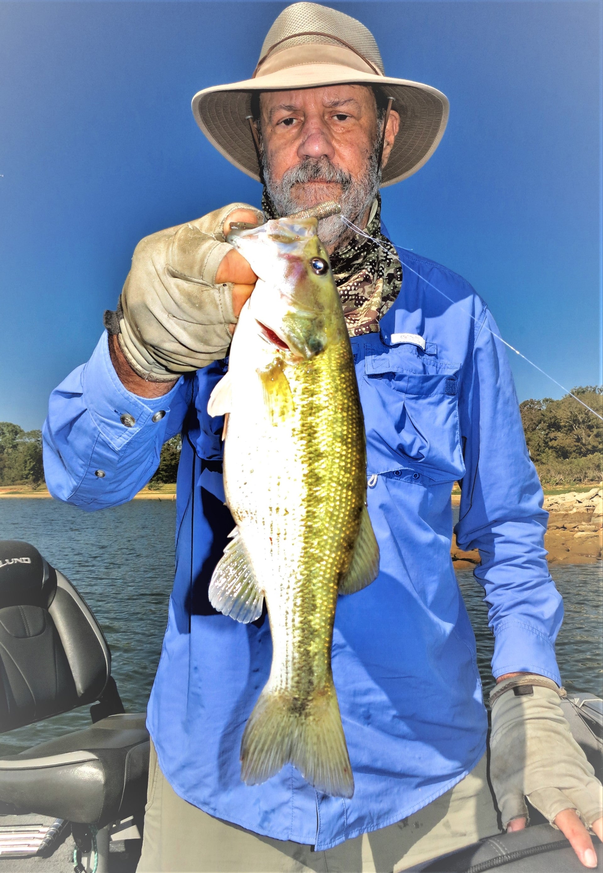 Gentleman holding a Large Mouth Bass