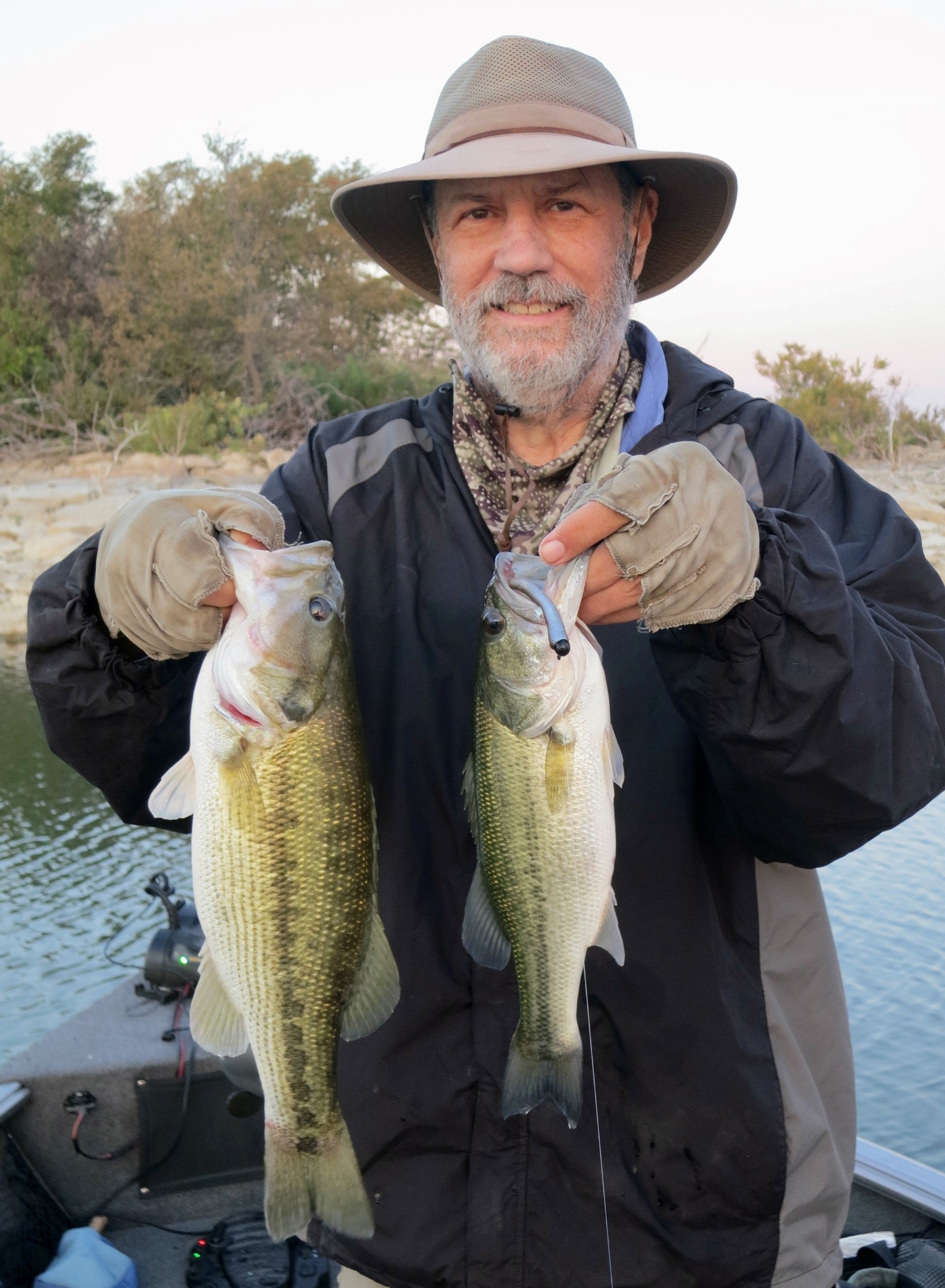 Gentleman with two Large Mouth Bass