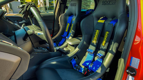 Sparco QRT Performance Seats with Schroth Harnesses on a customer's car