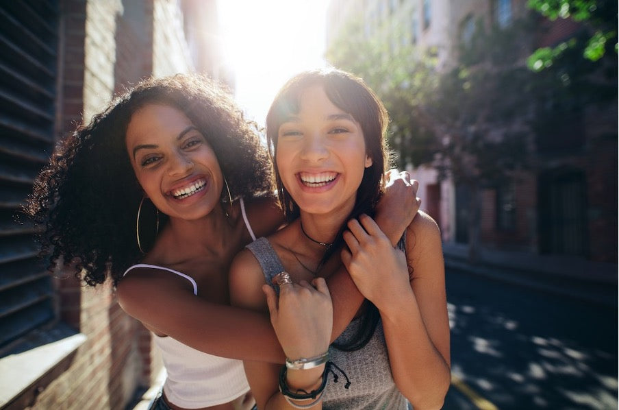 Two women smiling together