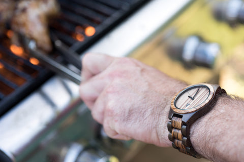 Man Wearing a Tree Hut Wood Watch Making BBQ Chicken