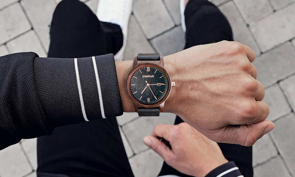 copper watch with black leather strap