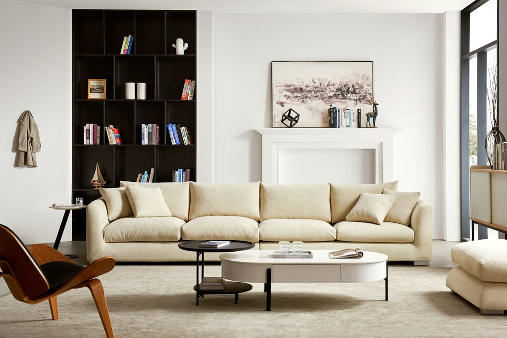 Feathers machine washable custom couch in beige set in a modern living room with a two-tone coffee table and midcentury modern accent chair.