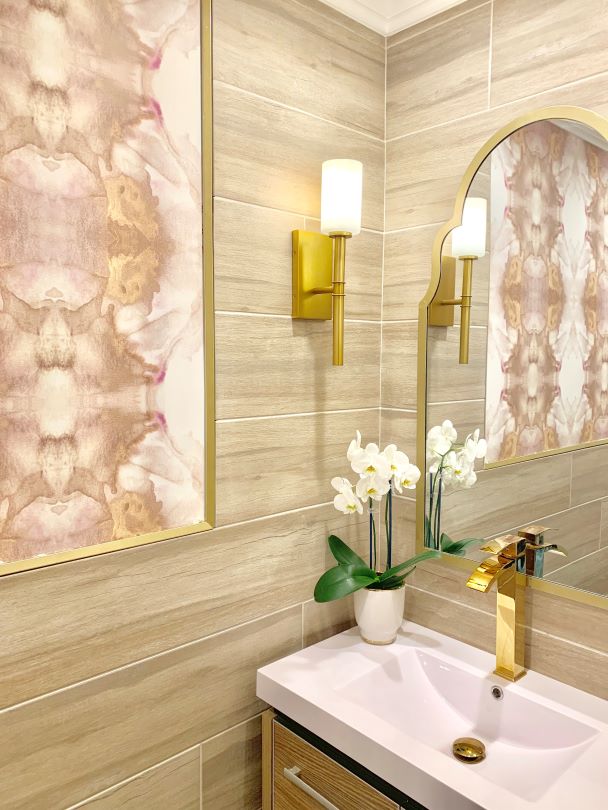 Abstract pink and brass gold wallpaper design in bathroom