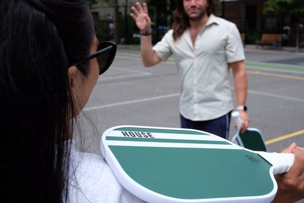 couple playing pickleball