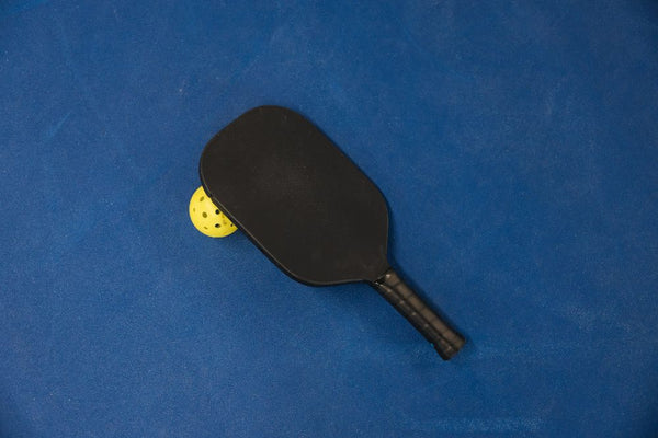 pickleball paddle and ball indoor