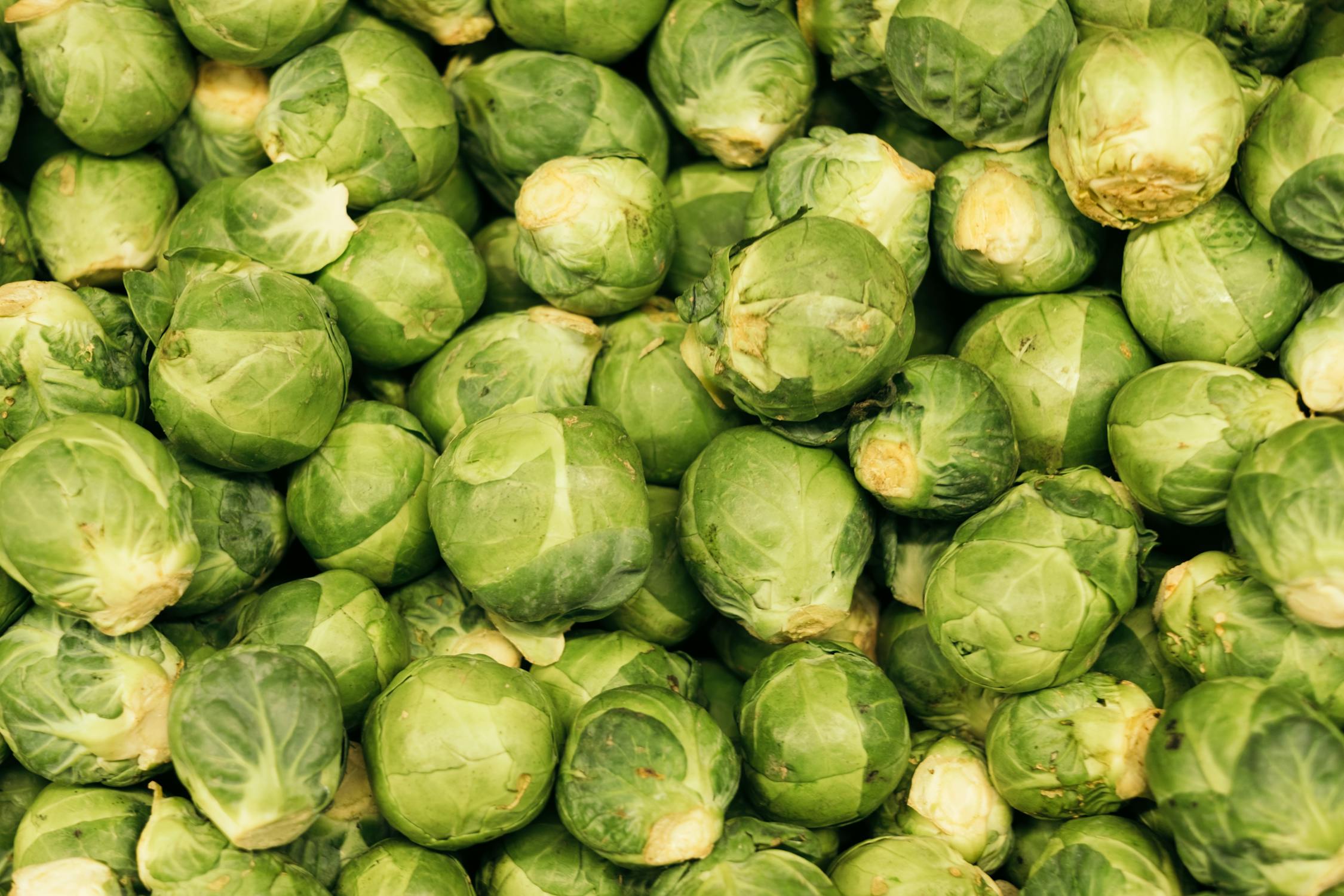 Huge heap of uncooked brussels sprouts