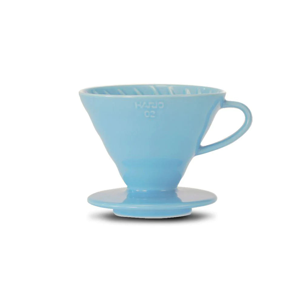 https://cdn.shopify.com/s/files/1/0667/4599/1448/products/ground-coffee-society-hario-V60-glass-coffee-dripper-blue-02-product.webp?v=1697274504&width=1000