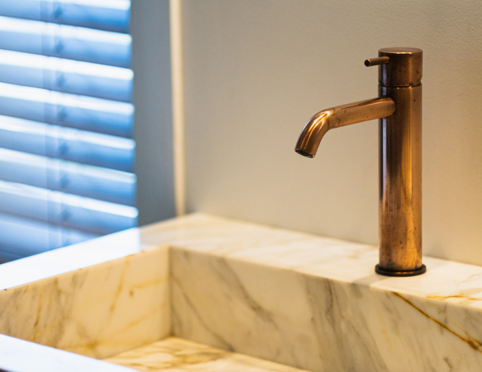 Hotbath basin faucet in Living Color Natural Brass showcasing the elegant design and timeless patina.