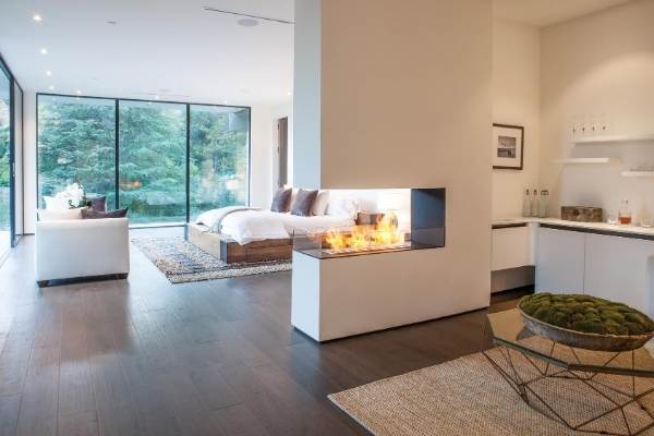 3-Sided Ethanol fireplace between kitchen and bedroom