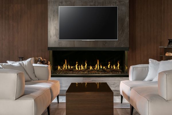 Dramatic modern fireplace with TV above in living room
