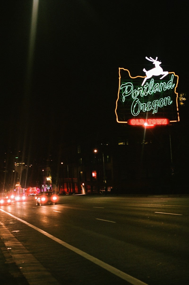 Portland sign with cars