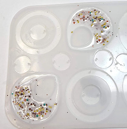 photo shows beads in both earring molds