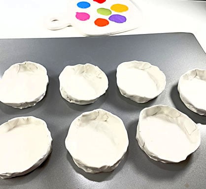 image shows bowls on baking sheet